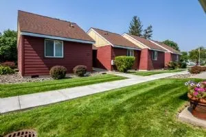 a front view of a house with garden