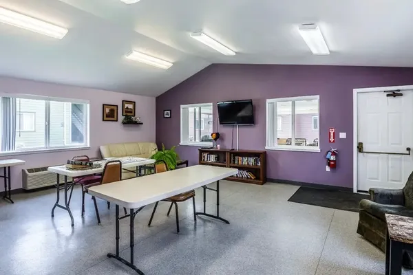 a view of a livingroom with furniture and a kitchen