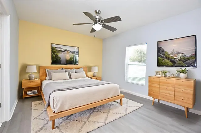 a bedroom with a bed and window