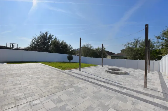 a view of a swimming pool with a yard