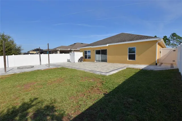 a house view with swimming pool in front of it