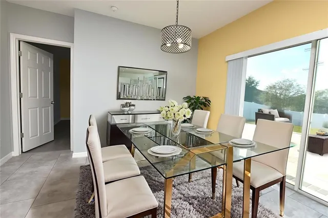 a view of a dining room with furniture wooden floor and a chandelier