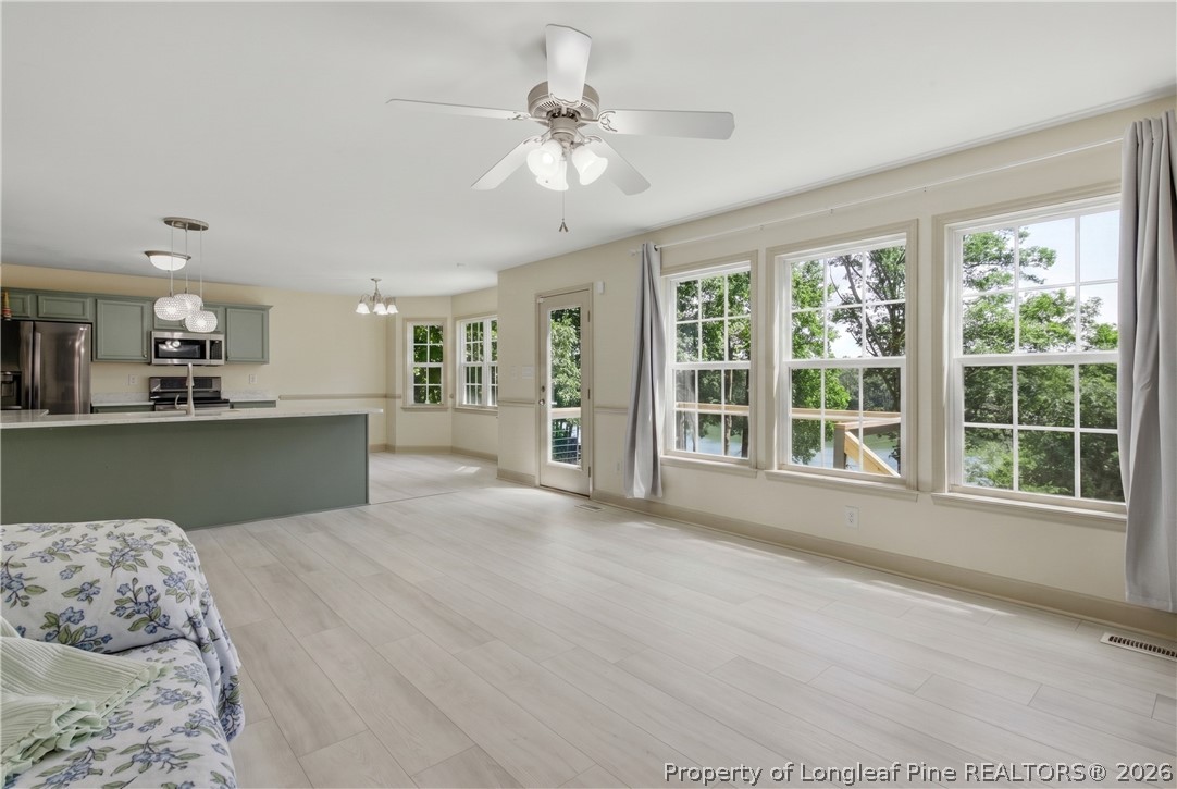1075 Buffalo Lake Road Sanford, NC 27332 - Photo 24 of 49 a view of a livingroom with furniture window and wooden floor