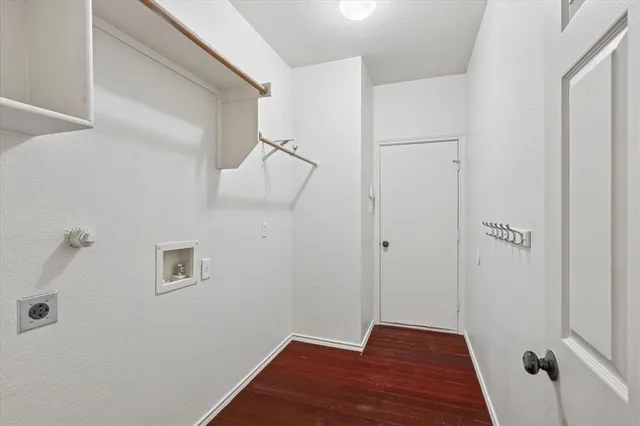 a view of a room with wooden floor and staircase