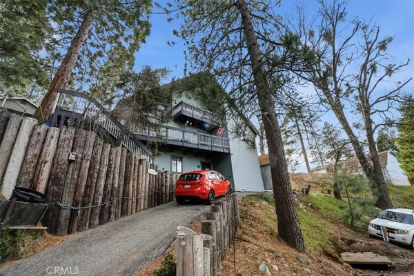 a view of a car park in front of house