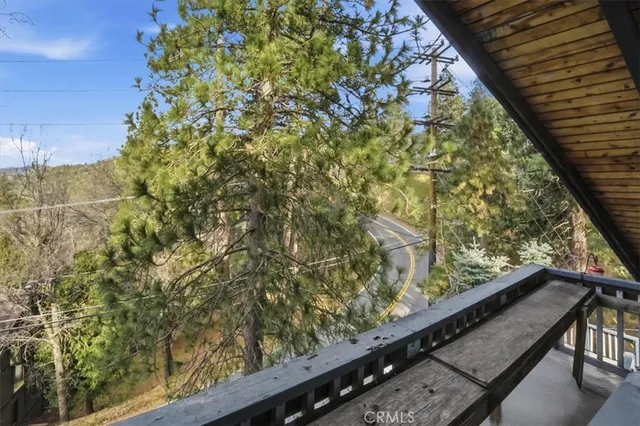 a view of a porch with wooden floor and stairs