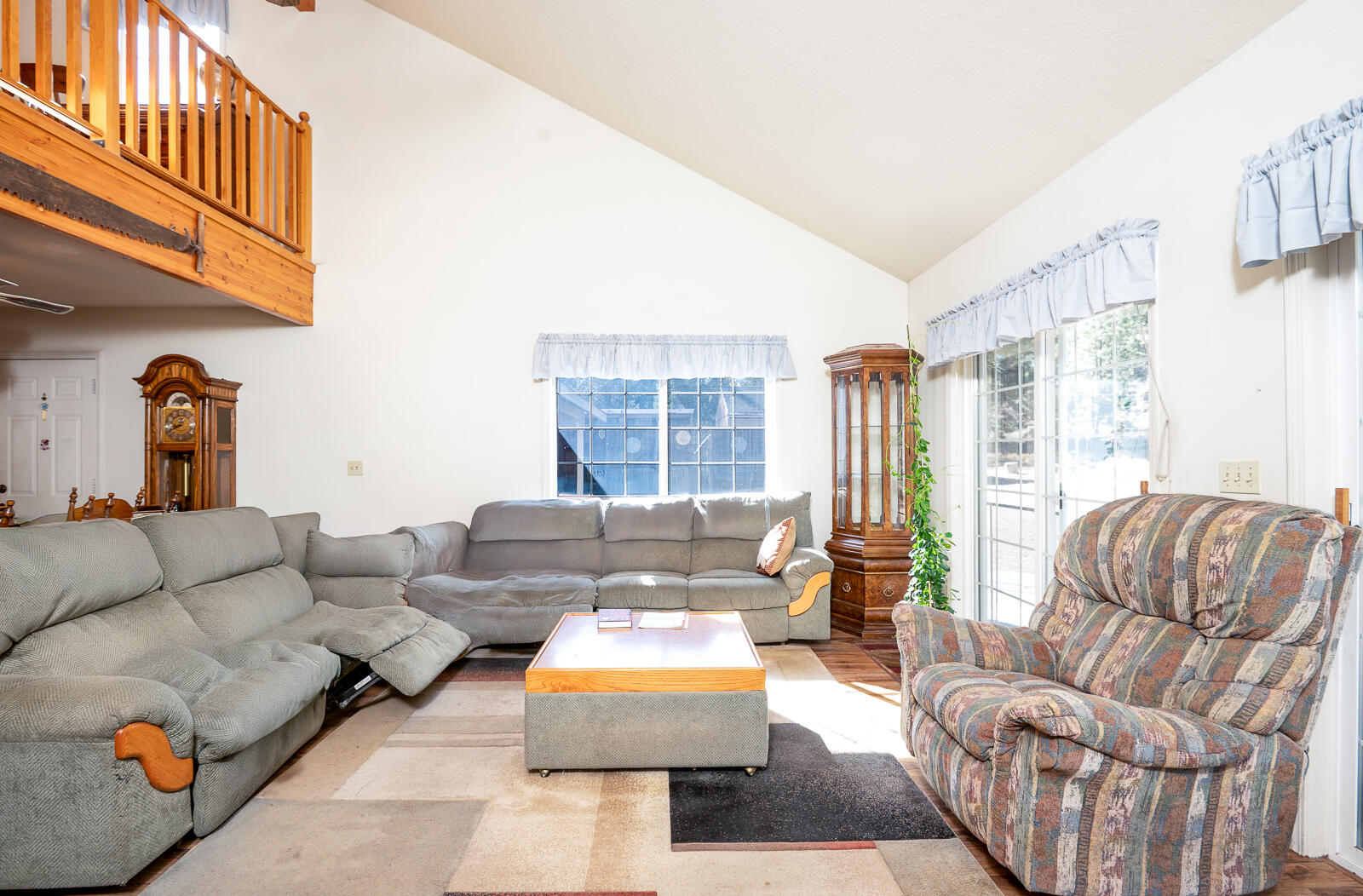 19793 Buck Canyon Road Bend, OR 97702 - Photo 7 of 33 a living room with furniture and a large window