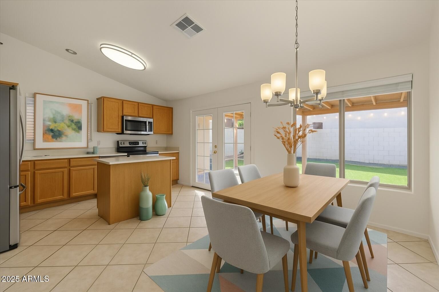 9163 West St John Road Peoria, AZ 85382 - Photo 11 of 38 a view of a dining room with furniture wooden floor and chandelier