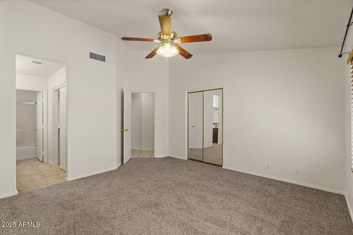 9163 West St John Road Peoria, AZ 85382 - Photo 20 of 38 a view of an empty room with a ceiling fan