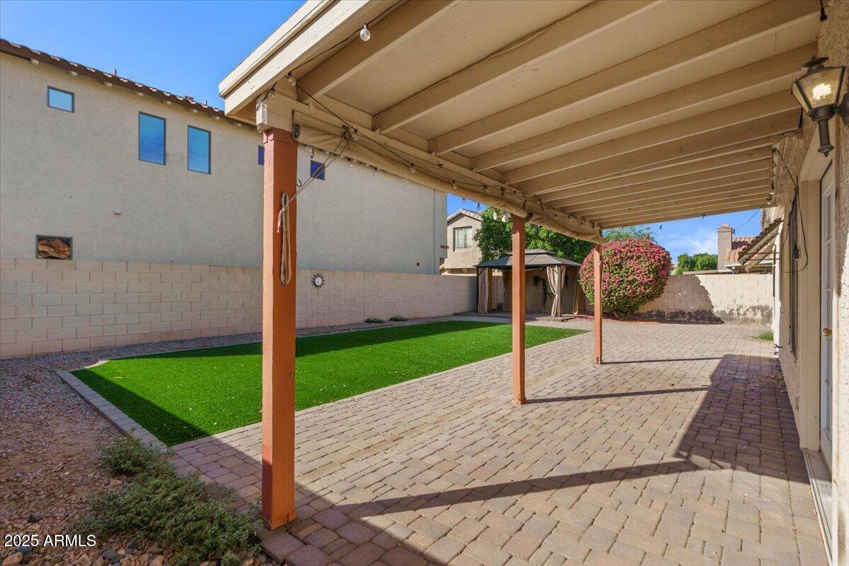 9163 West St John Road Peoria, AZ 85382 - Photo 30 of 38 a view of a backyard