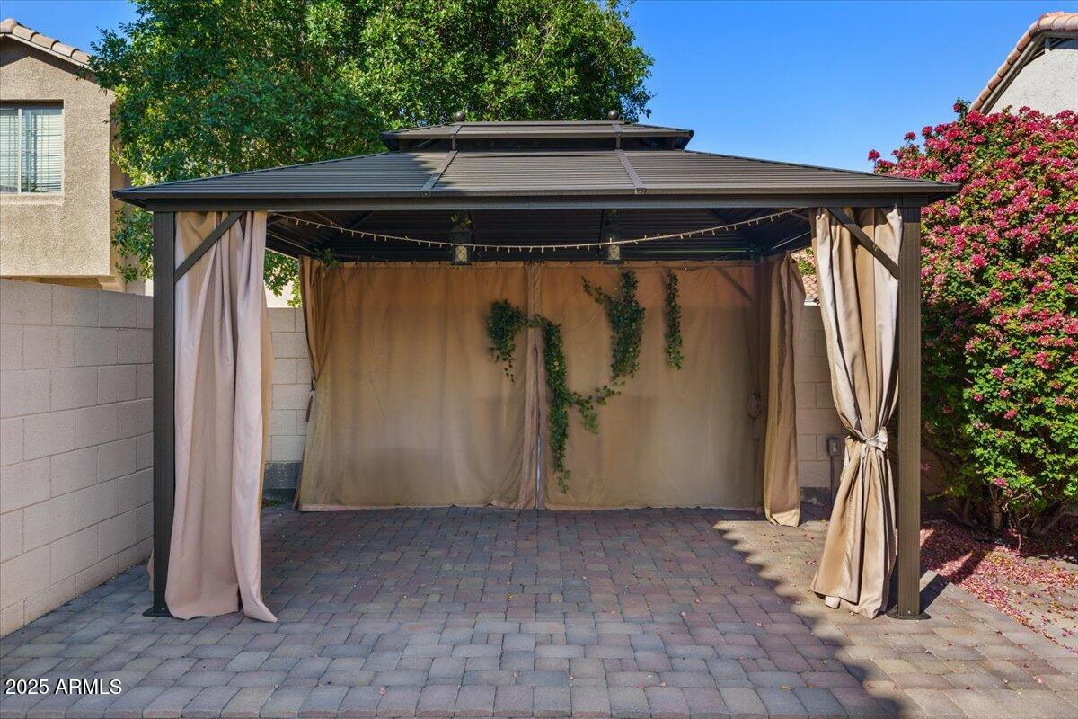 9163 West St John Road Peoria, AZ 85382 - Photo 33 of 38 a view of front door and small trees