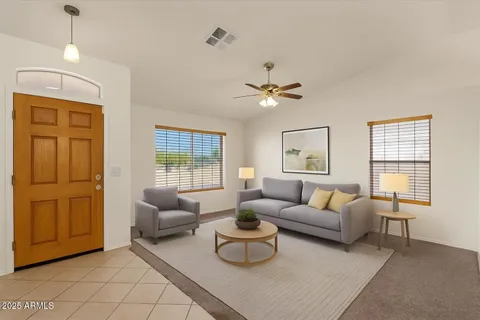 a view of a house with a small yard and plants