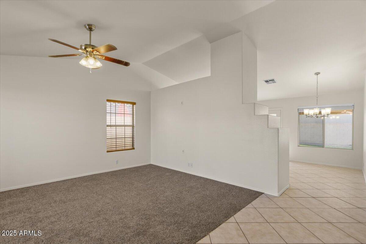 9163 West St John Road Peoria, AZ 85382 - Photo 8 of 38 a view of empty room with a ceiling fan and window