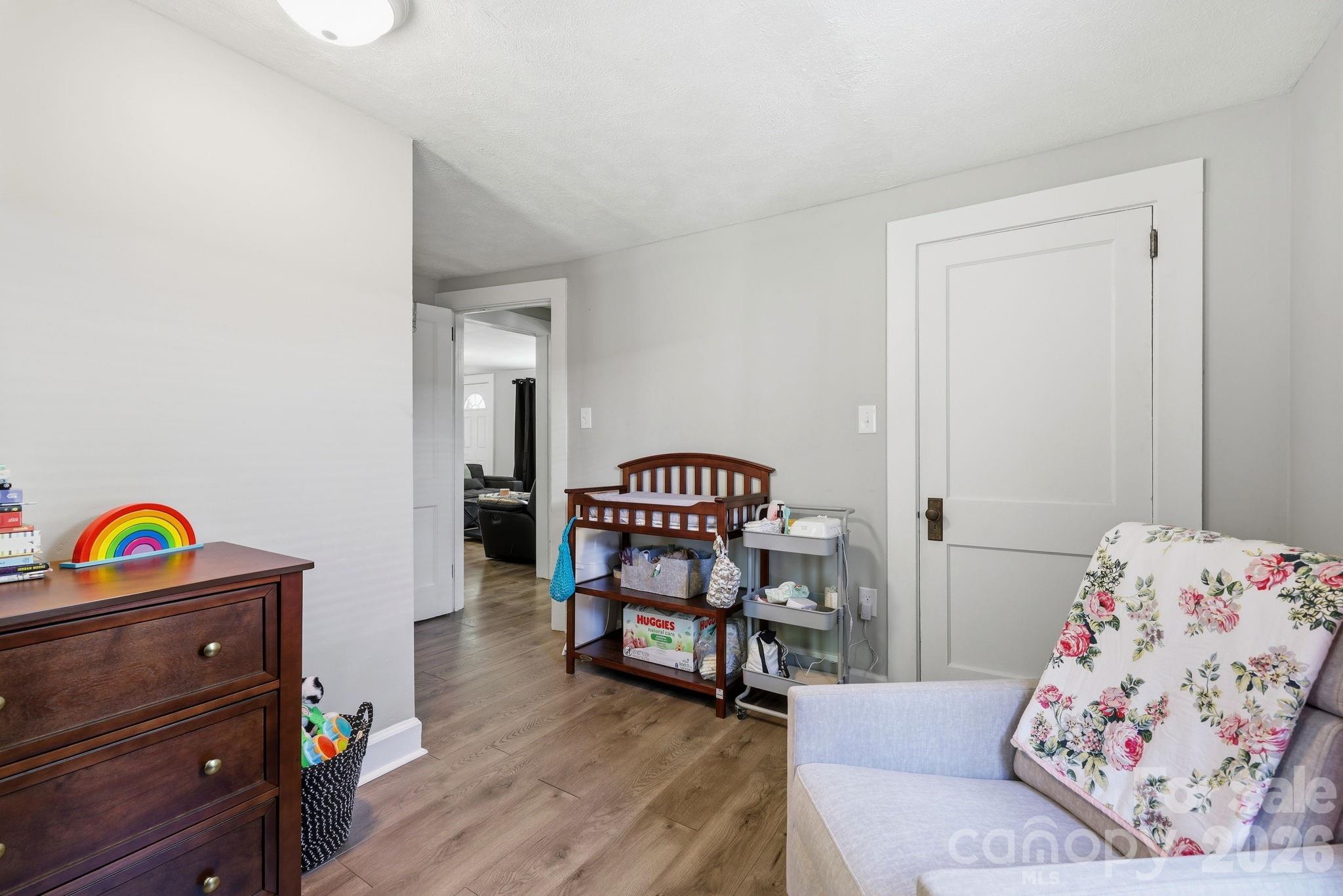 197 Mulberry Street Clyde, NC 28721 - Photo 17 of 31 a bedroom with a bed and toys