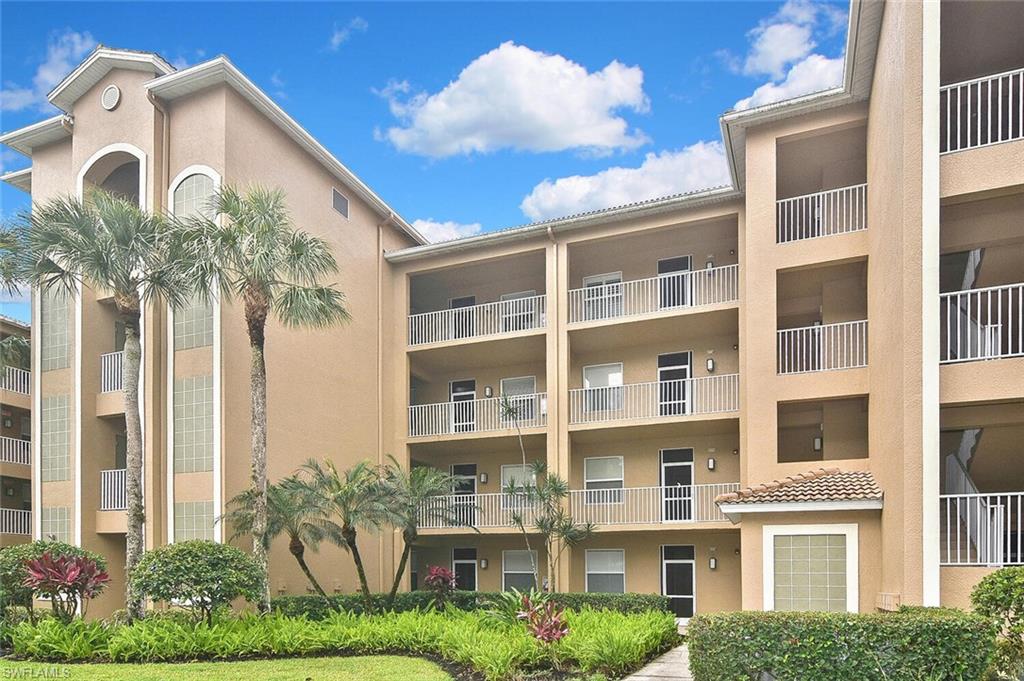 3830 Sawgrass Way, Unit 2946 Naples, FL 34112 - Photo 2 of 49 a front view of a multi story building
