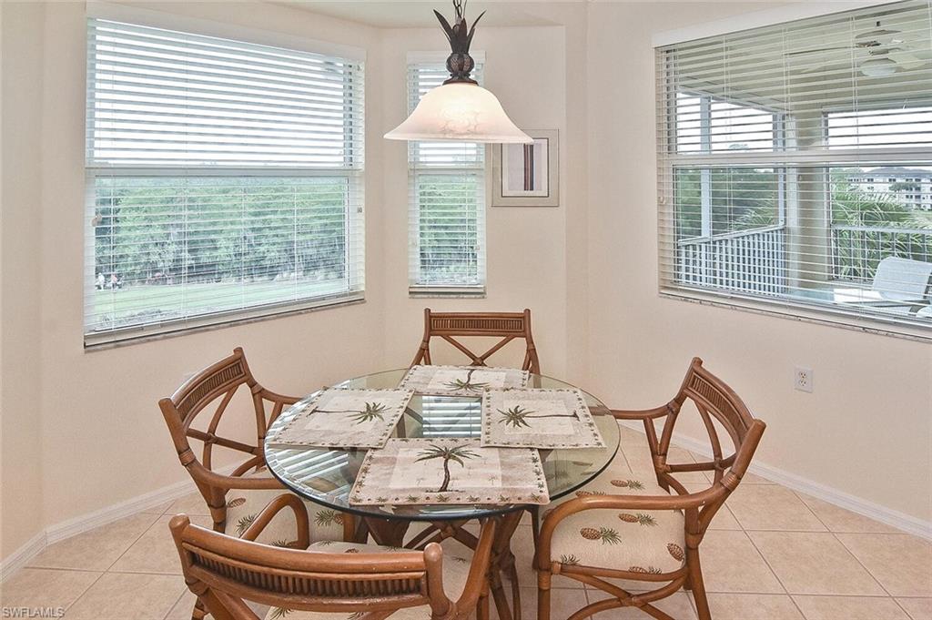 3830 Sawgrass Way, Unit 2946 Naples, FL 34112 - Photo 30 of 49 a view of a dining room with furniture window and outside view