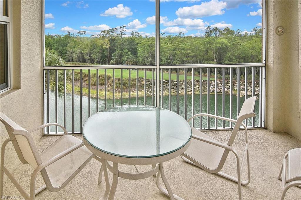 3830 Sawgrass Way, Unit 2946 Naples, FL 34112 - Photo 37 of 49 a view of a chairs and table in the balcony
