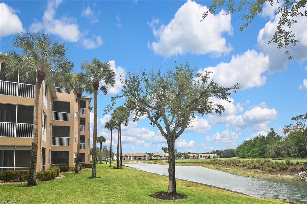 3830 Sawgrass Way, Unit 2946 Naples, FL 34112 - Photo 42 of 49 a view of a city with large trees