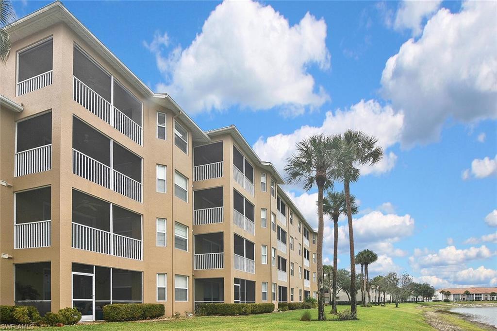 3830 Sawgrass Way, Unit 2946 Naples, FL 34112 - Photo 45 of 49 a front view of a building