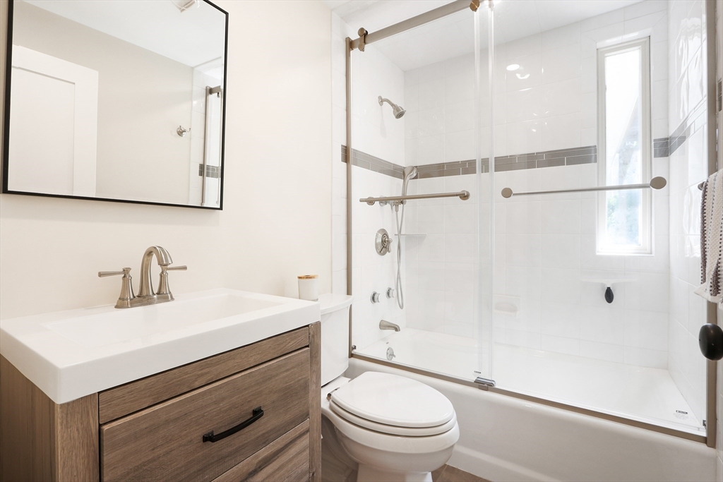 247 Greendale Avenue Needham, MA 02494 - Photo 12 of 33 a bathroom with a sink a toilet and shower