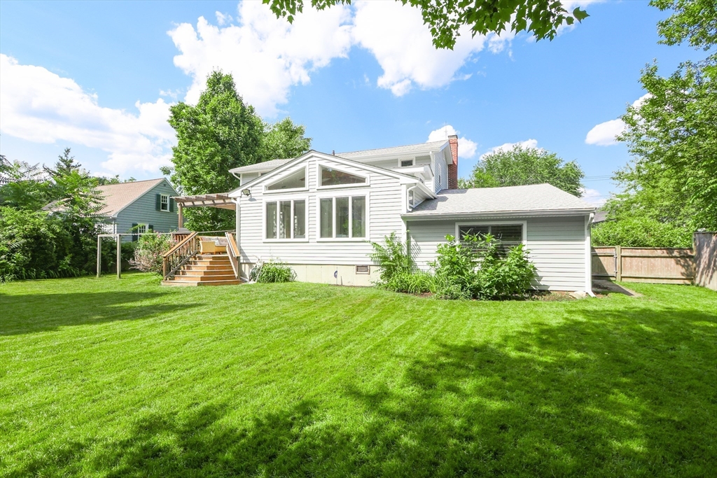 247 Greendale Avenue Needham, MA 02494 - Photo 32 of 33 a front view of a house with a garden