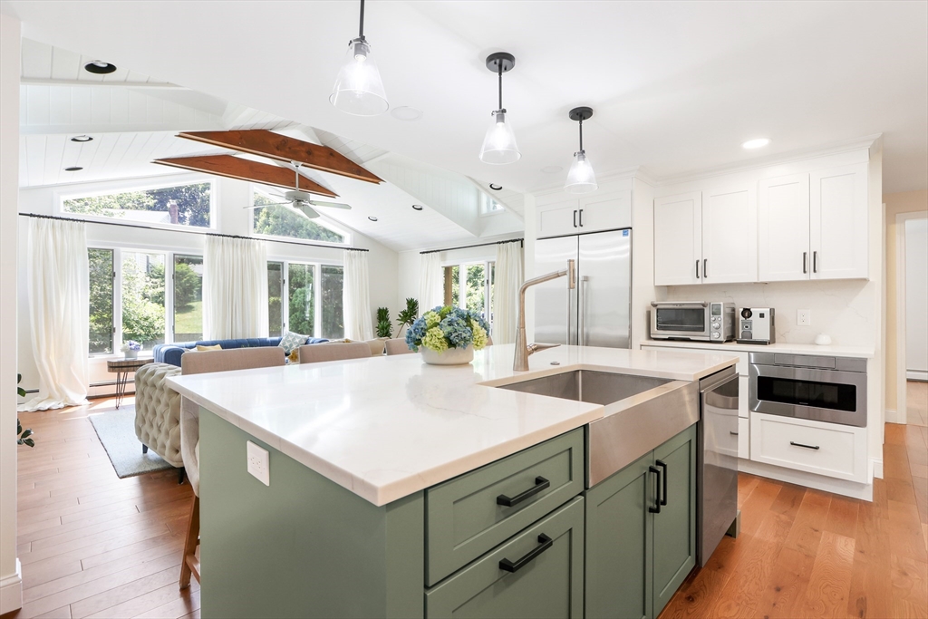 247 Greendale Avenue Needham, MA 02494 - Photo 7 of 33 a kitchen with a stove a sink and a refrigerator