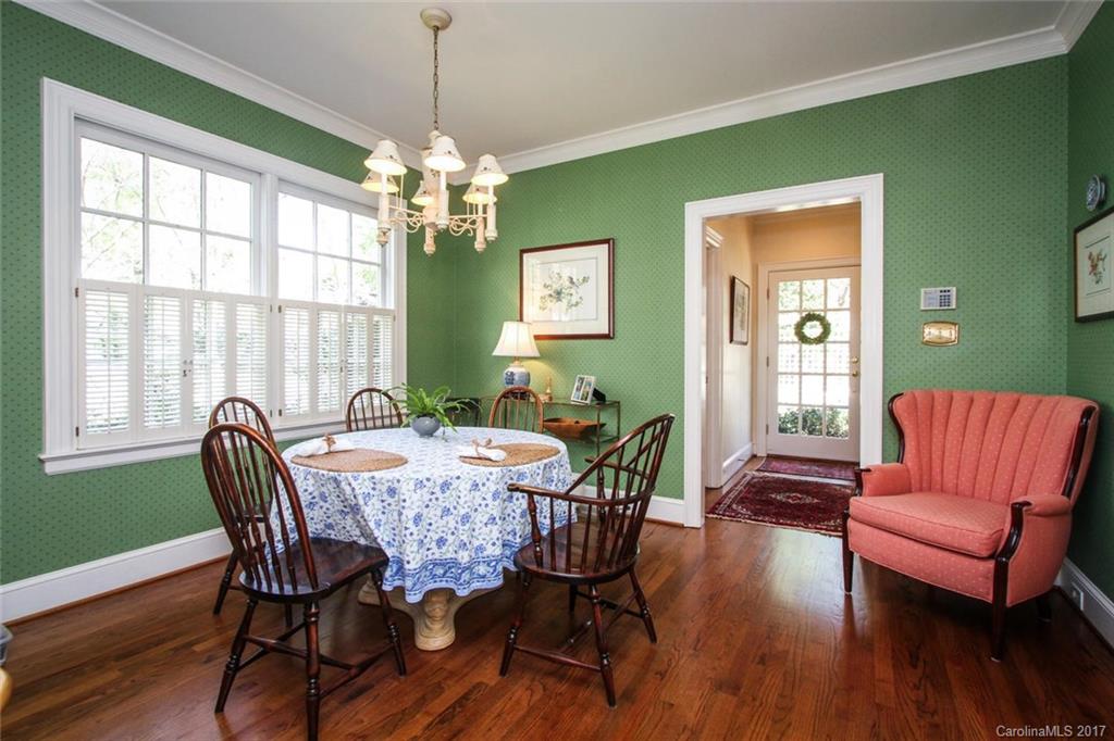 1245 Providence Road Charlotte, NC 28207 - Photo 11 of 24 a view of a dining room with furniture window and wooden floor