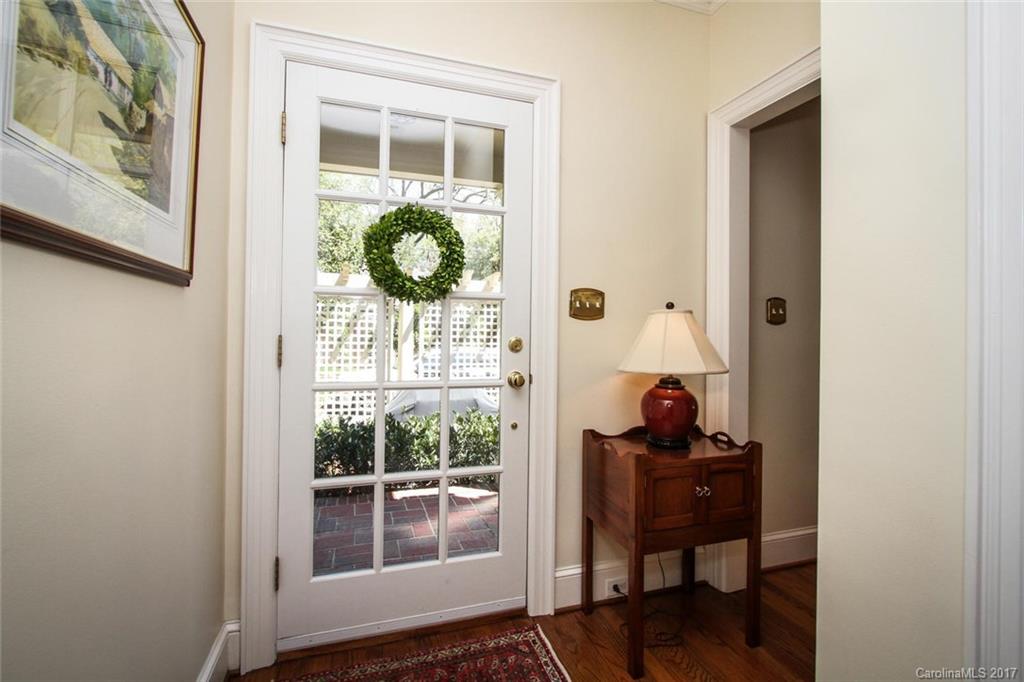 1245 Providence Road Charlotte, NC 28207 - Photo 12 of 24 a view of entryway with wooden floor and windows