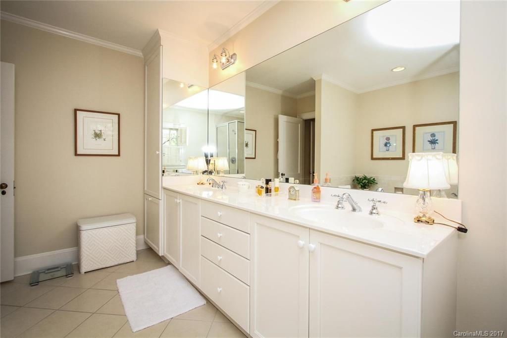 1245 Providence Road Charlotte, NC 28207 - Photo 17 of 24 a bathroom with a sink a toilet and mirror