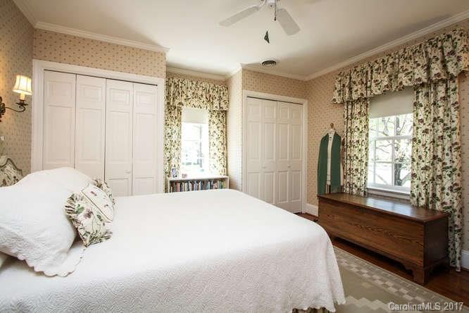 1245 Providence Road Charlotte, NC 28207 - Photo 19 of 24 a bedroom with a bed and a window