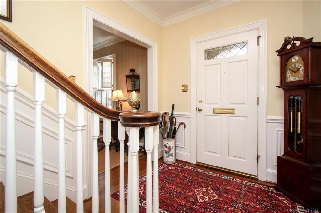 1245 Providence Road Charlotte, NC 28207 - Photo 3 of 24 a view of an entryway with wooden floor and livingroom