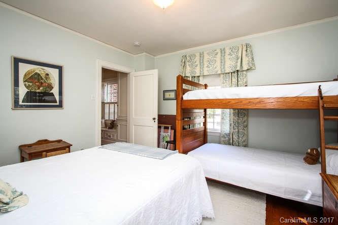 1245 Providence Road Charlotte, NC 28207 - Photo 21 of 24 a bedroom with a bed and dresser