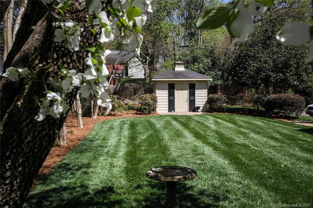 1245 Providence Road Charlotte, NC 28207 - Photo 24 of 24 a front view of a house with a yard and trees