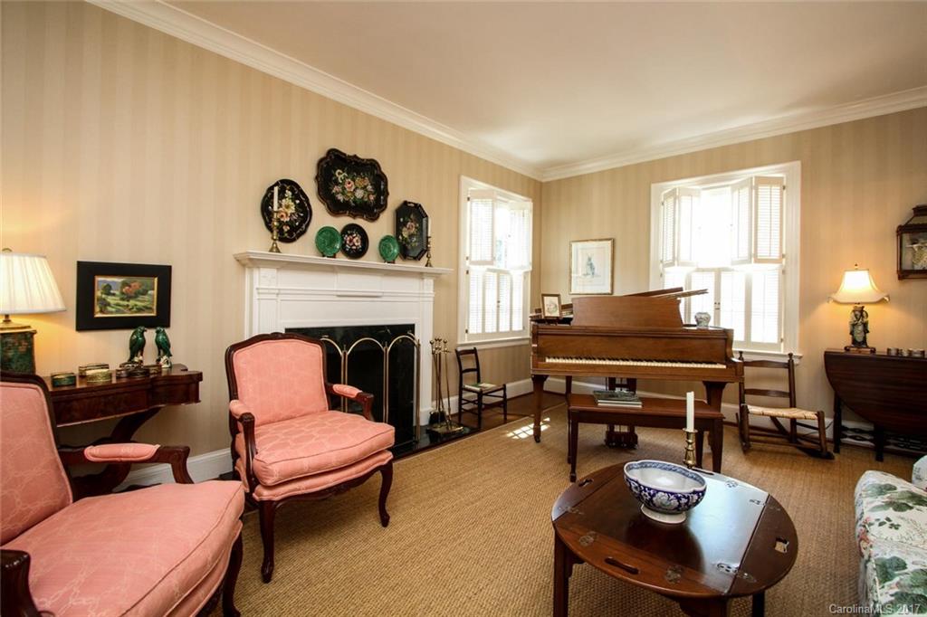 1245 Providence Road Charlotte, NC 28207 - Photo 4 of 24 a living room with furniture a fireplace and a window