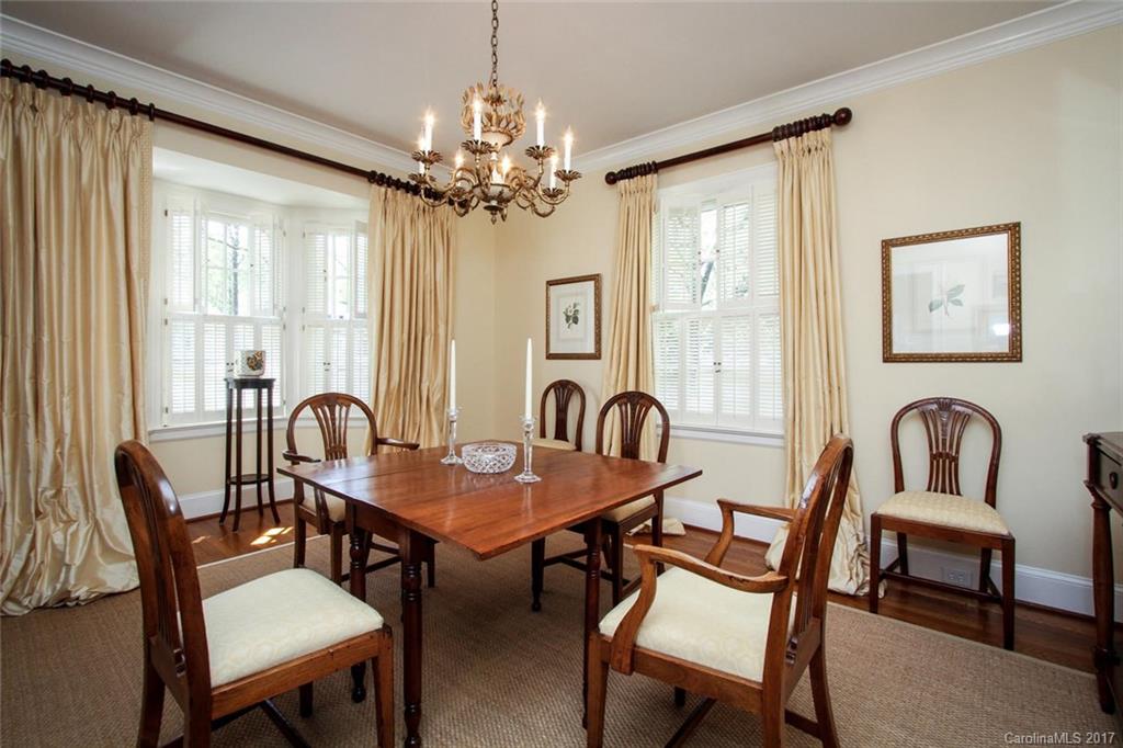 1245 Providence Road Charlotte, NC 28207 - Photo 5 of 24 a view of a a dining room with furniture window and wooden floor