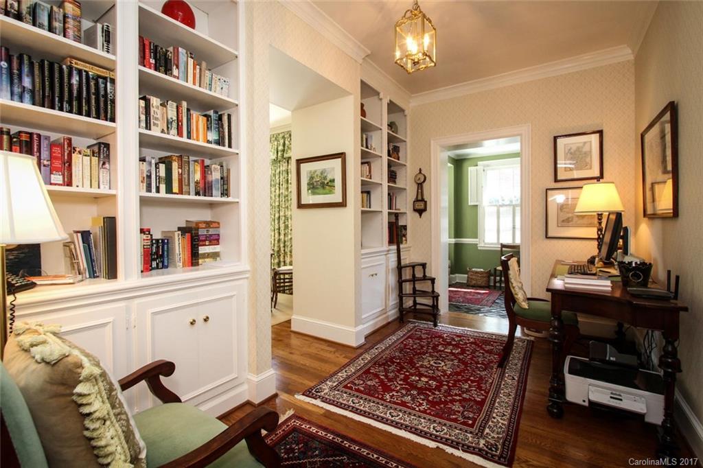 1245 Providence Road Charlotte, NC 28207 - Photo 7 of 24 a living room with furniture and a book shelf