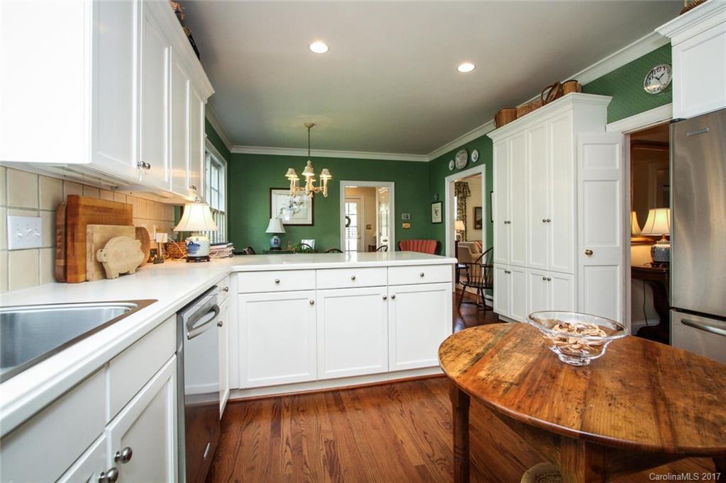 1245 Providence Road Charlotte, NC 28207 - Photo 10 of 24 a kitchen with a sink appliances cabinets and furniture