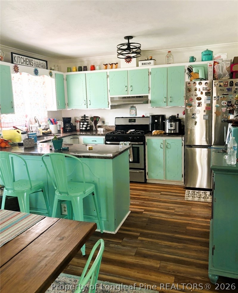 2038 Dunn Road Eastover, NC 28312 - Photo 5 of 29 a kitchen with a table and chairs in it