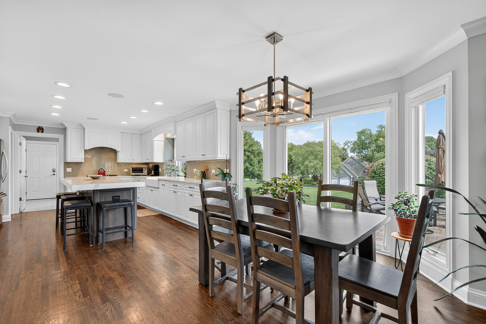 20633 North Primrose Court Deer Park, IL 60010 - Photo 7 of 43 a view of a dining room and livingroom with furniture wooden floor a chandelier