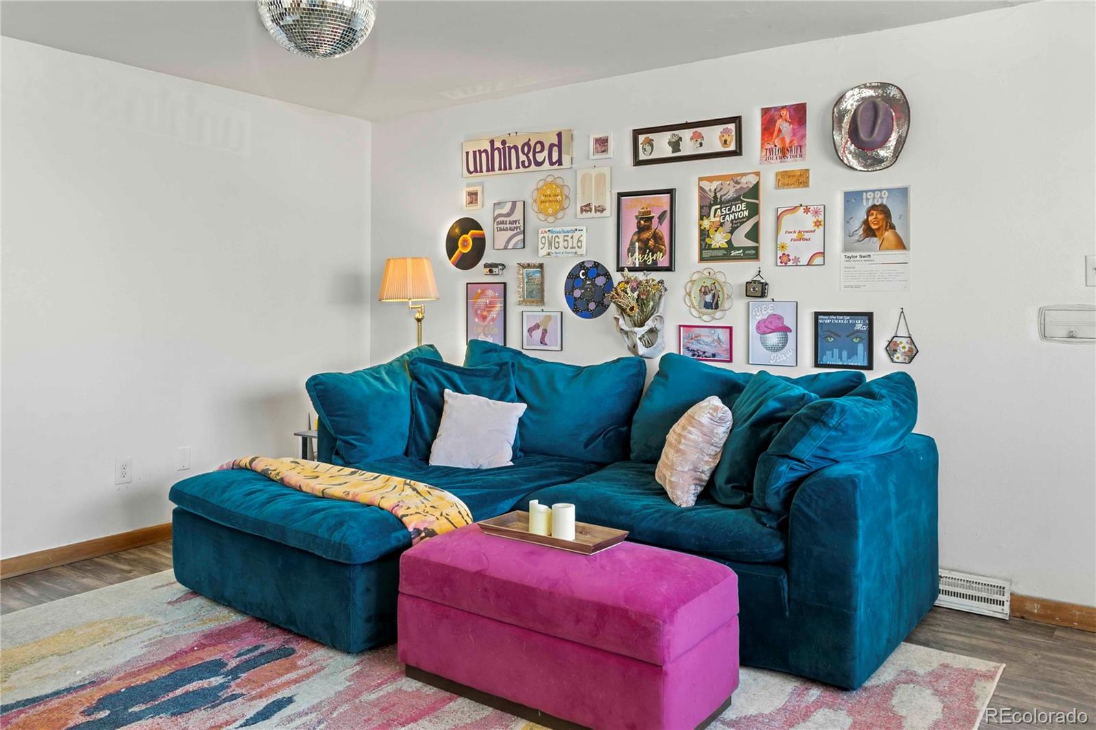 3358 Pontiac Street Denver, CO 80207 - Photo 2 of 26 a living room with furniture and baby couch
