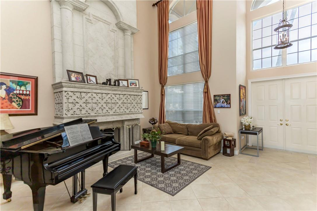 4185 Southwest 186th Way Miramar, FL 33029 - Photo 18 of 92 a living room with furniture a fireplace and a table