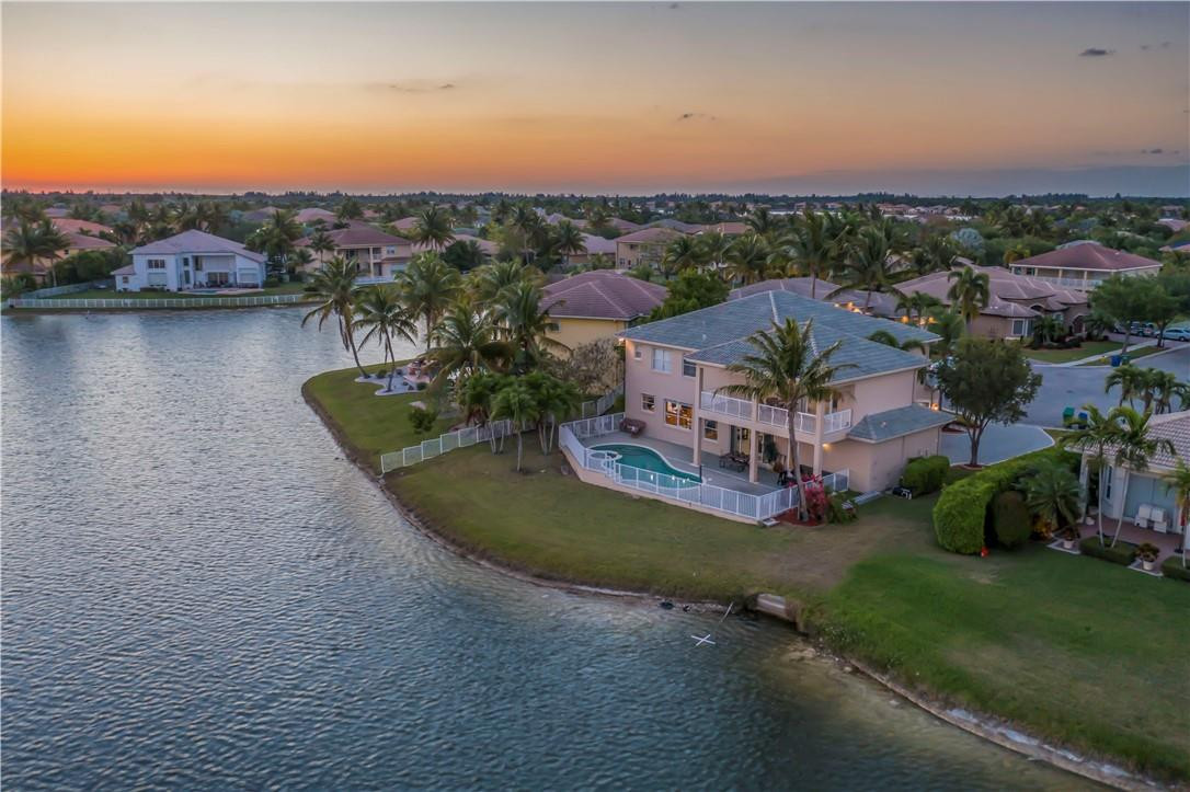 4185 Southwest 186th Way Miramar, FL 33029 - Photo 3 of 92 an aerial view of a house with a garden and lake view