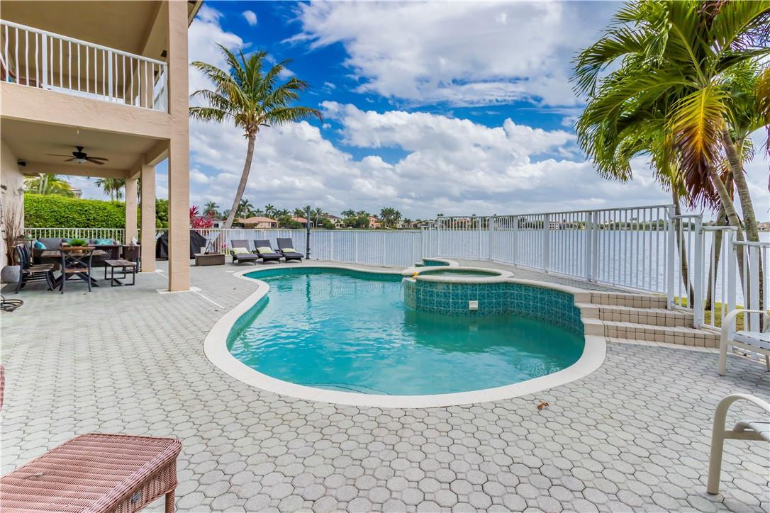 4185 Southwest 186th Way Miramar, FL 33029 - Photo 46 of 92 a view of a swimming pool with a patio