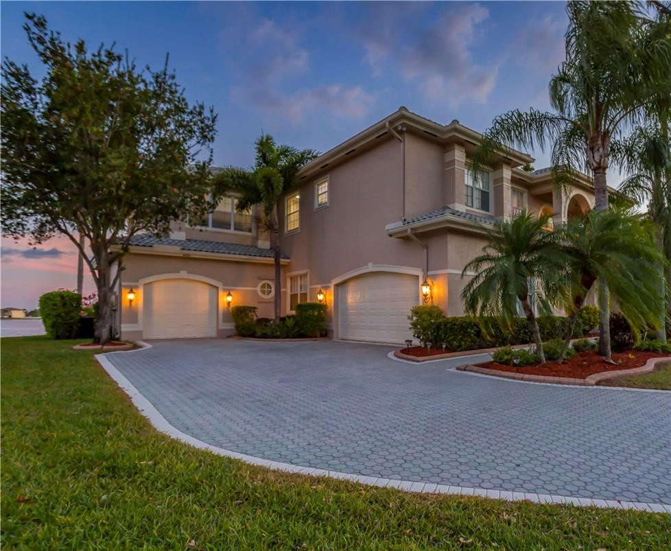 4185 Southwest 186th Way Miramar, FL 33029 - Photo 59 of 92 a front view of a house with a yard and a garage