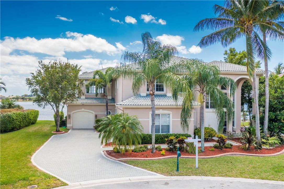 4185 Southwest 186th Way Miramar, FL 33029 - Photo 62 of 92 a front view of multi story residential apartment building with yard and green space