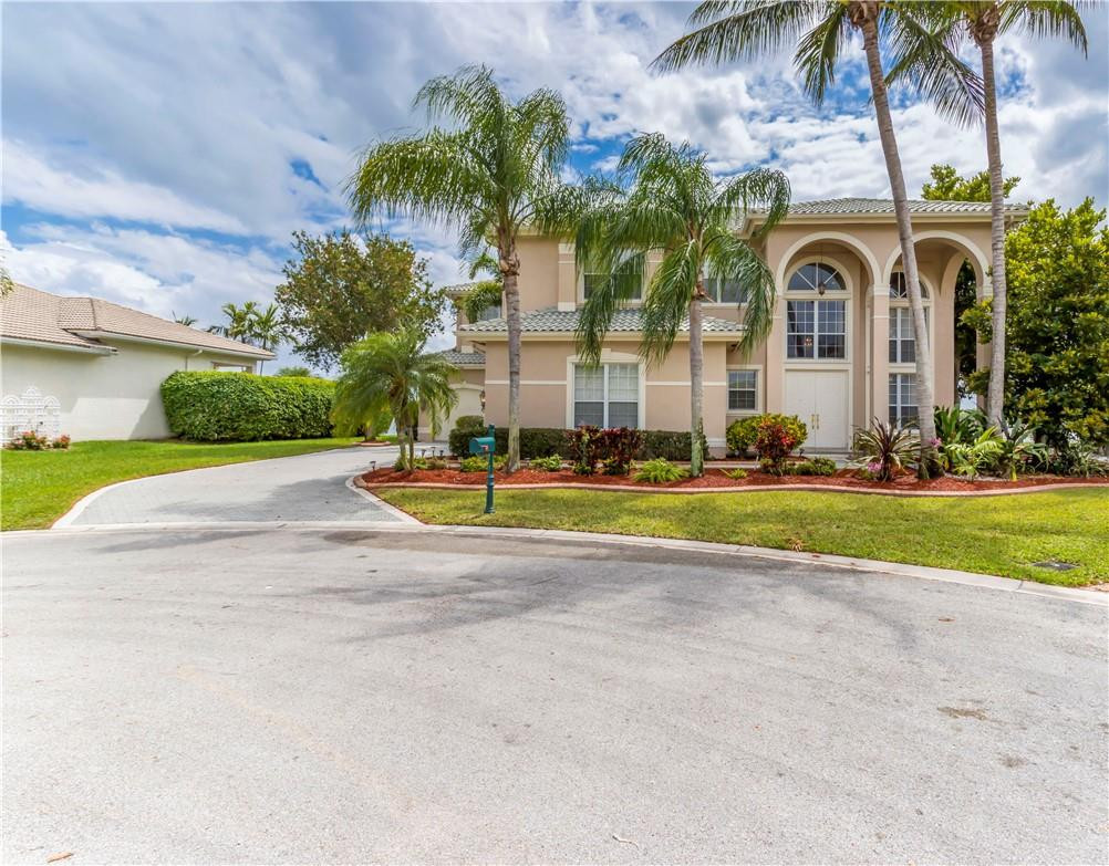 4185 Southwest 186th Way Miramar, FL 33029 - Photo 68 of 92 a view of a white house with a big yard and palm trees