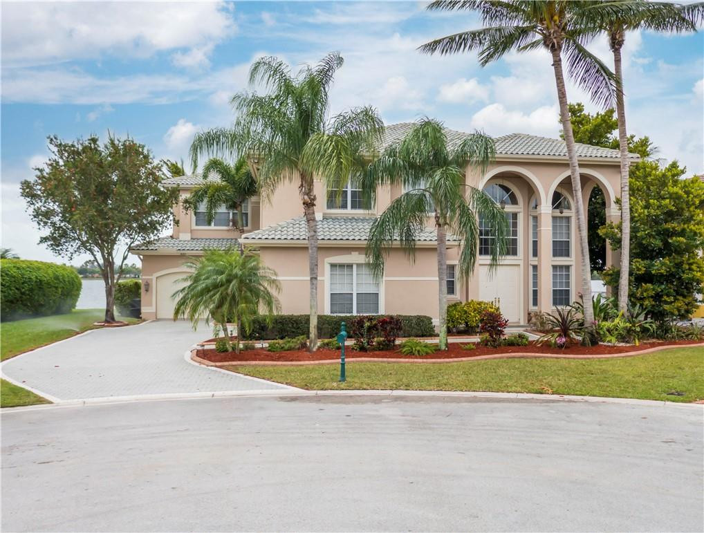 4185 Southwest 186th Way Miramar, FL 33029 - Photo 69 of 92 a front view of multiple houses with yard