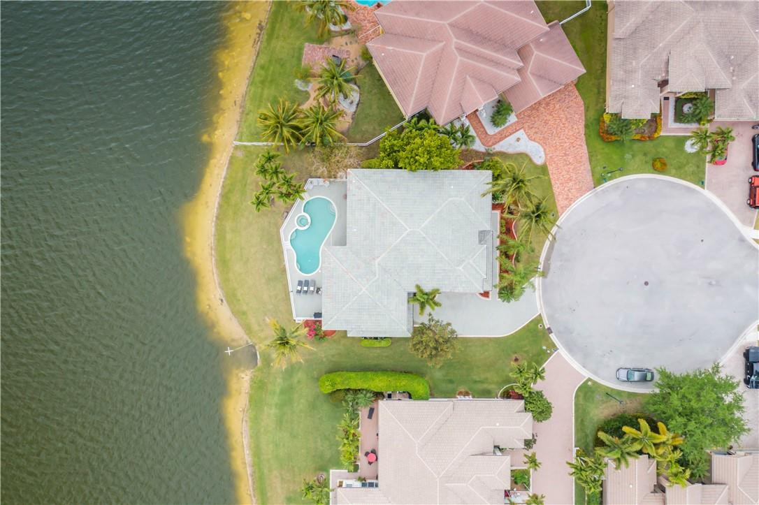 4185 Southwest 186th Way Miramar, FL 33029 - Photo 75 of 92 an aerial view of a house with a swimming pool and a yard