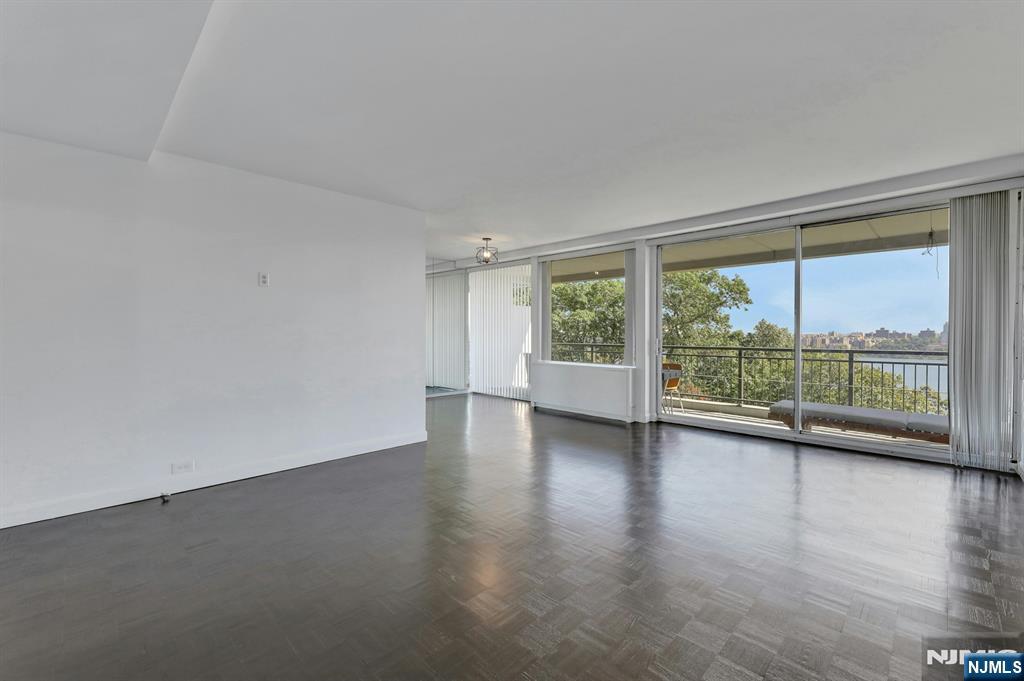 1 Horizon Road, Unit 609 Fort Lee, NJ 07024 - Photo 15 of 40 a view of a room with wooden floor and window