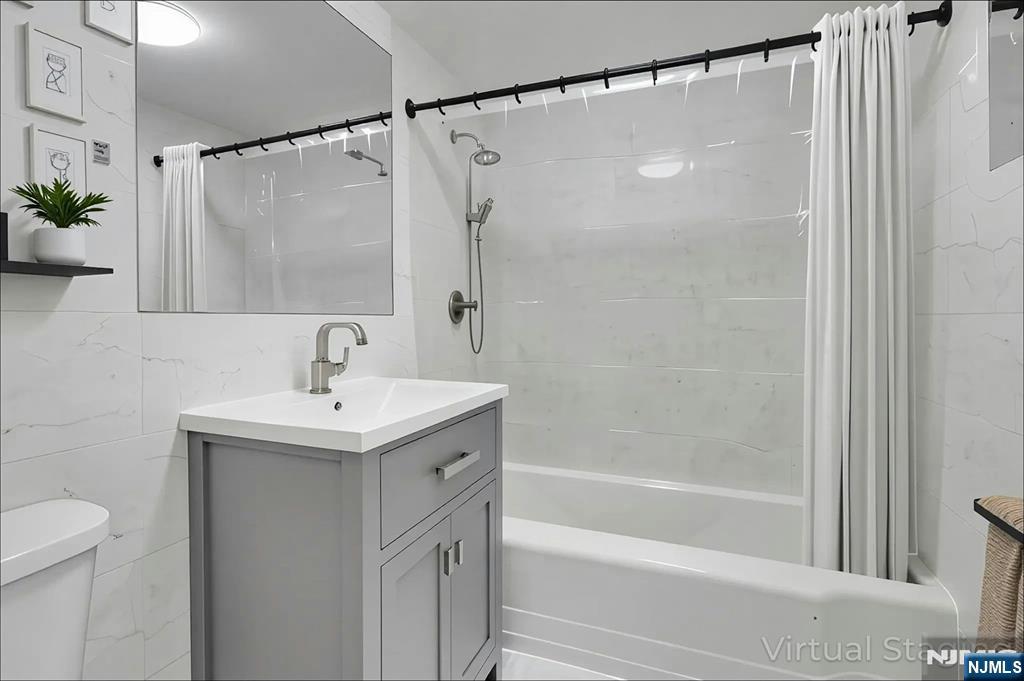 1 Horizon Road, Unit 609 Fort Lee, NJ 07024 - Photo 24 of 40 a bathroom with a shower and a sink